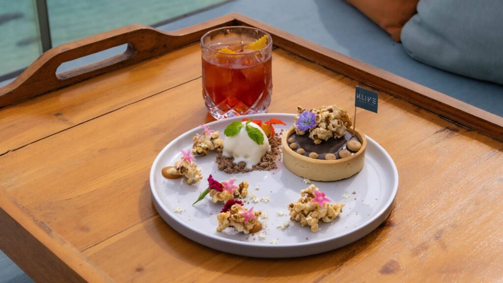 Chocolate tart with caramel popcorn and a Classic Negroni at Klive Beach Club Uluwatu.